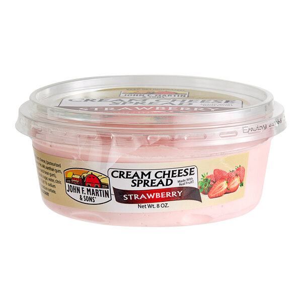 A plastic container of John F. Martin Strawberry Cream Cheese Spread.