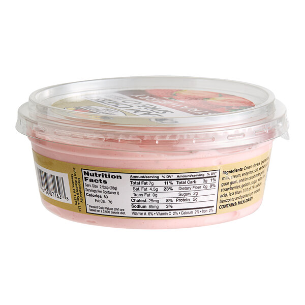 A container of John F. Martin Strawberry Cream Cheese Spread with a label on a table in a deli.