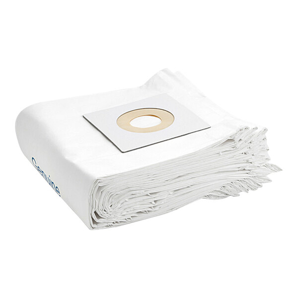 A stack of white paper bags with a hole in the middle.