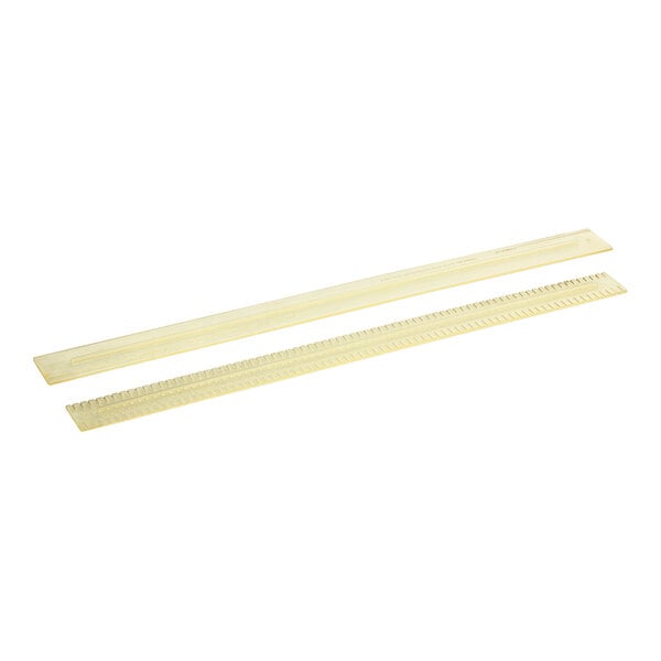 A white package with two yellow plastic strips.