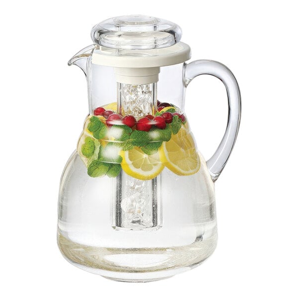 A clear plastic pitcher with water and fruit inside.