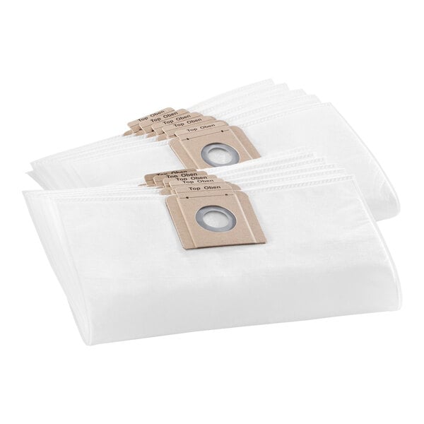 A stack of white Karcher fleece vacuum bags with brown labels.