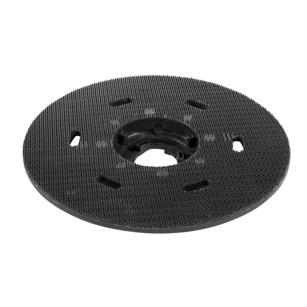A black circular object with a hole in the center.