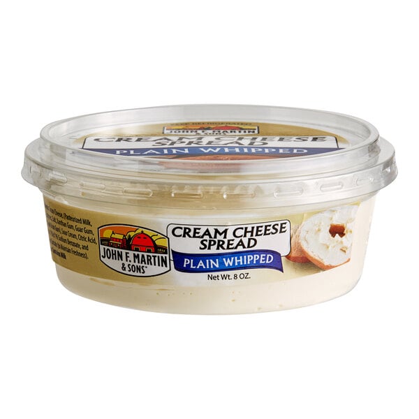 A container of John F. Martin Plain Whipped Cream Cheese Spread.