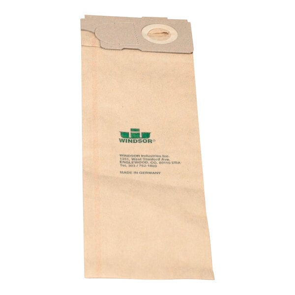 A close-up of a brown paper bag with a green label.