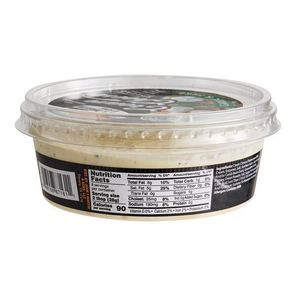 A container of John F. Martin Garlic and Herb Cream Cheese Spread with a label.