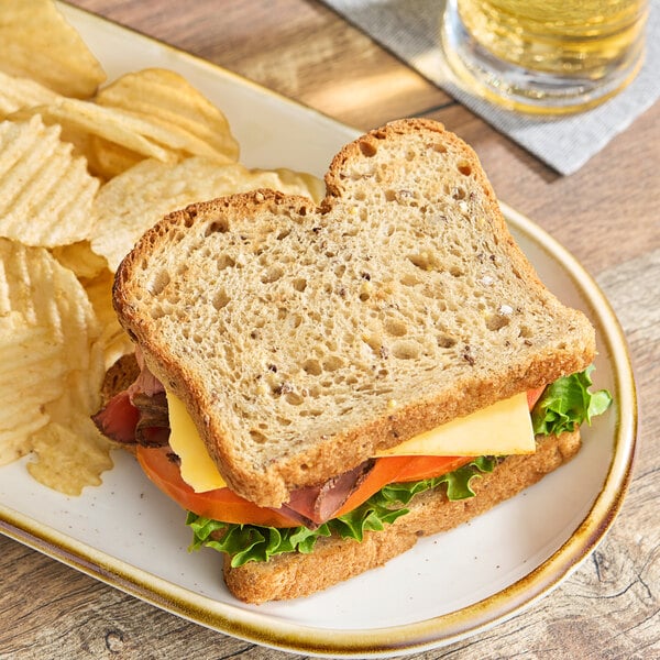 A sandwich on a plate with OMG...It's Gluten Free 5-Grain Bread.