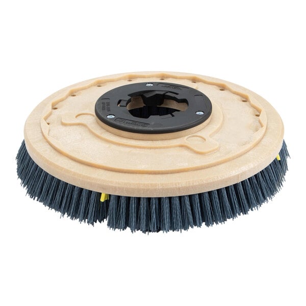 A black circular Karcher mild grit brush with a hole in it.