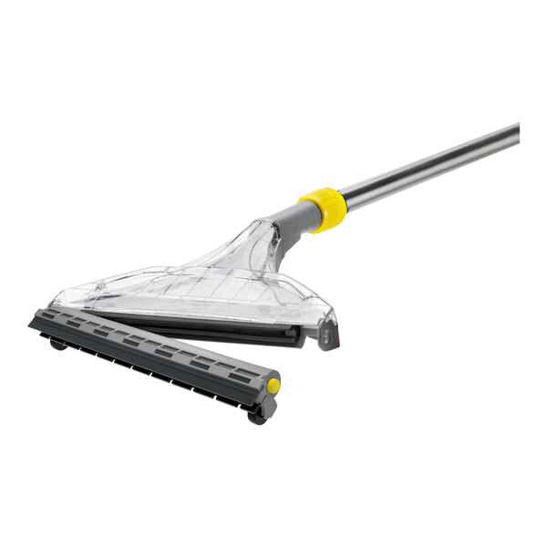 A black rubber hard floor adapter with a yellow handle for a Karcher Puzzi 30/4.