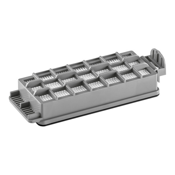 A grey rectangular air filter with holes in it.