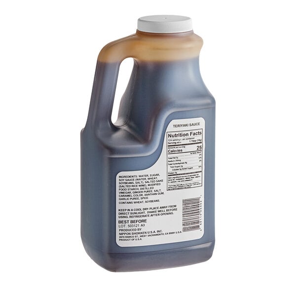 A Nippon Shokken bottle of teriyaki sauce with a white cap on a white background.