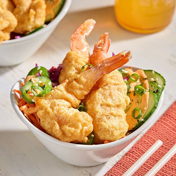 A bowl of fried shrimp and vegetables with Nippon Shokken Tempura Batter Mix.