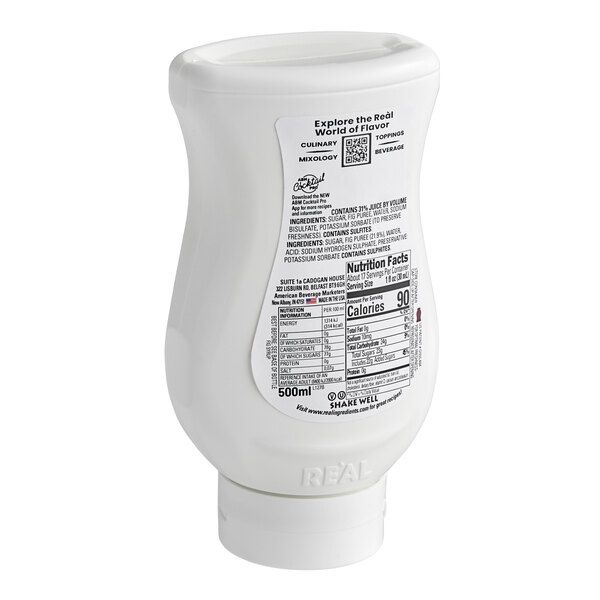 A white plastic bottle of Real Fig Puree Infused Syrup with a black label.