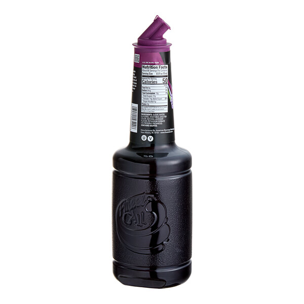 A bottle of Finest Call lavender syrup with a purple cap.