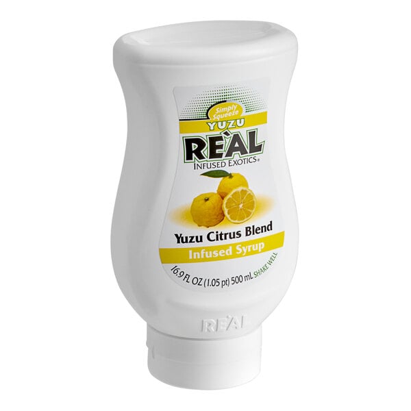 A white plastic container with a yellow label for Real Yuzu Puree Infused Syrup.