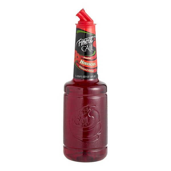 A bottle of Finest Call Premium Hibiscus Syrup with a red cap and red liquid.