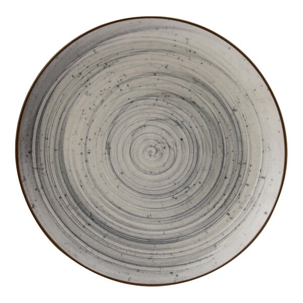 A close-up of a Cosy & Trendy Sintra dusty blue stoneware deep coupe plate with a spiral design.