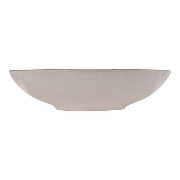 A terracotta stoneware deep coupe plate with a rim on a white background.