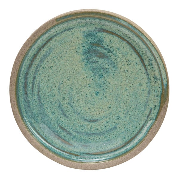 A close-up of a Cosy & Trendy Ocean Green stoneware saucer with a brown rim.