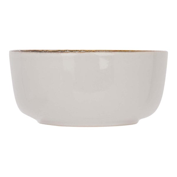 A white Cosy & Trendy stoneware bowl with gold rim.