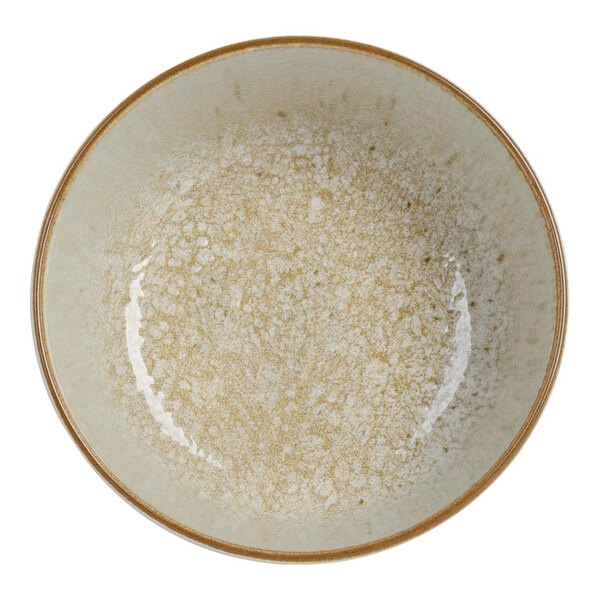 A close up of a Cosy & Trendy Baltic Luna beige stoneware bowl with a white and brown speckled design.