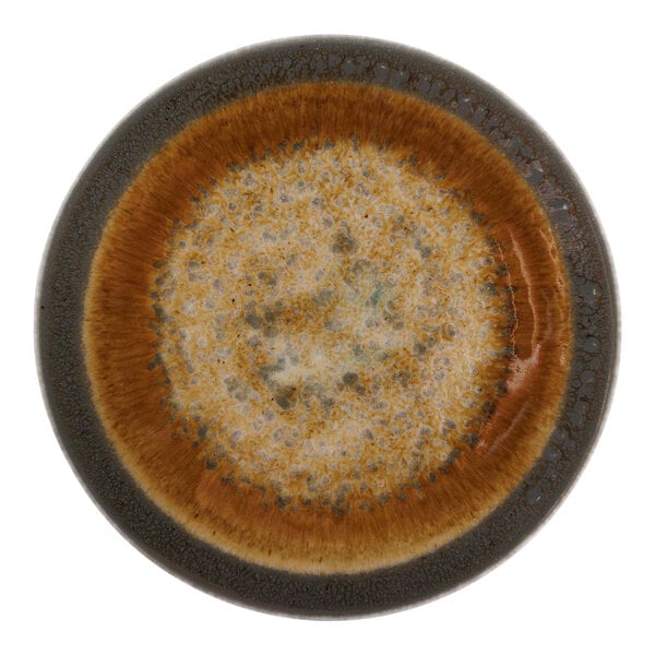 A close up of a brown Cosy & Trendy Iris porcelain coupe plate with a brown rim.