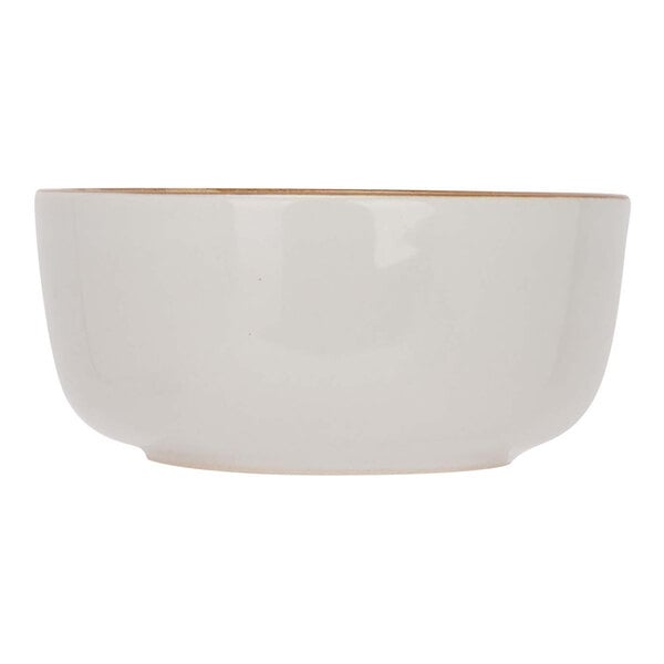 A white stoneware bowl with a gold rim.