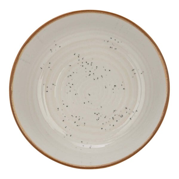 A white Cosy & Trendy stoneware bowl with black specks.
