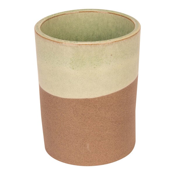 A Cosy & Trendy mint green stoneware mug with a handle.