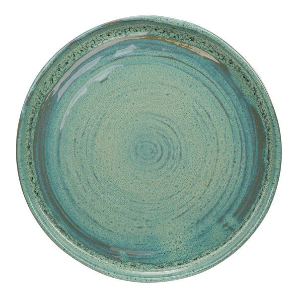 A close up of a Cosy & Trendy Ocean Green stoneware plate with a circular design.