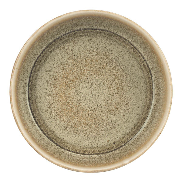 A close up of a green Cosy & Trendy Melia porcelain bowl.