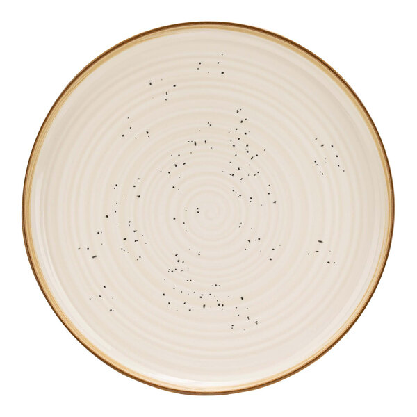 A white Cosy & Trendy stoneware coupe plate with black dots.