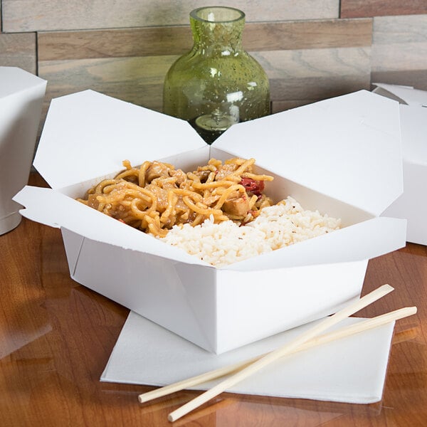 A white Fold-Pak Bio-Pak take-out box with food inside.