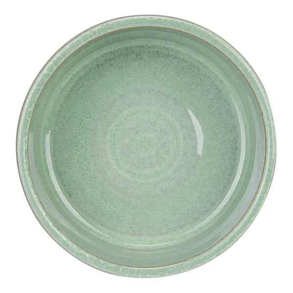 A round, mint green ceramic dish with a glossy finish and subtle textured pattern, viewed from above.