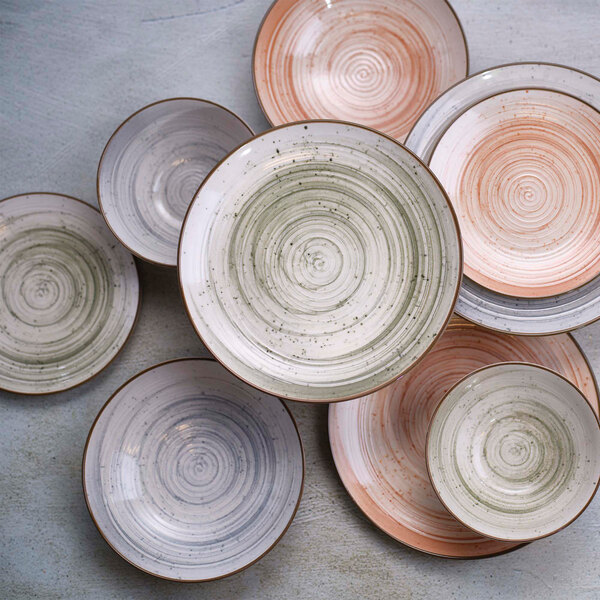 A stack of Cosy & Trendy Sintra stoneware plates with a dusty blue design.