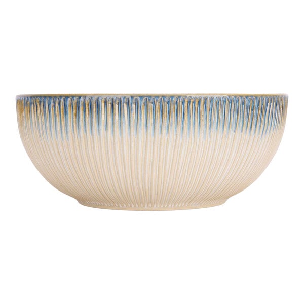 A Cosy & Trendy porcelain serving bowl with blue and white stripes.