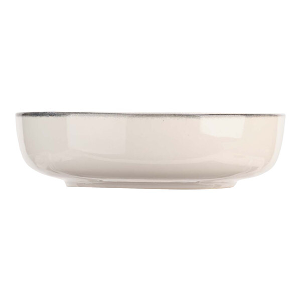 A white Cosy & Trendy stoneware bowl with a silver rim.