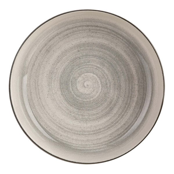 A close up of a Cosy & Trendy gray stoneware bowl with a white swirly circle design.