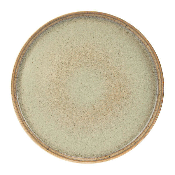 A green Cosy & Trendy Melia porcelain raised plate with a brown rim.