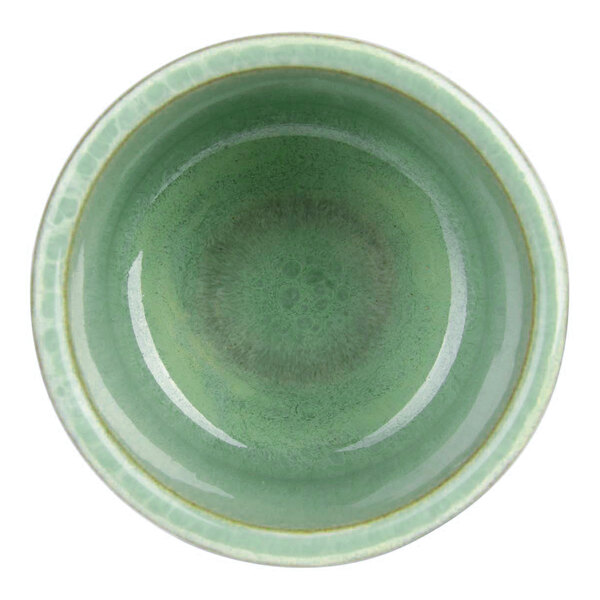 A round, mint green ceramic bowl with a glossy finish, viewed from above.