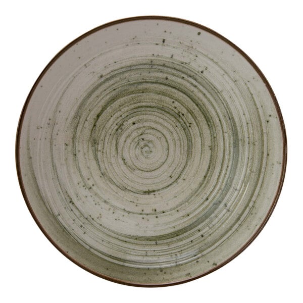 A close-up of a Cosy & Trendy Ivy Green stoneware plate with a spiral design in the center.