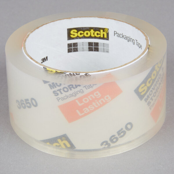 A roll of 3M Scotch clear packing tape with labels on it.