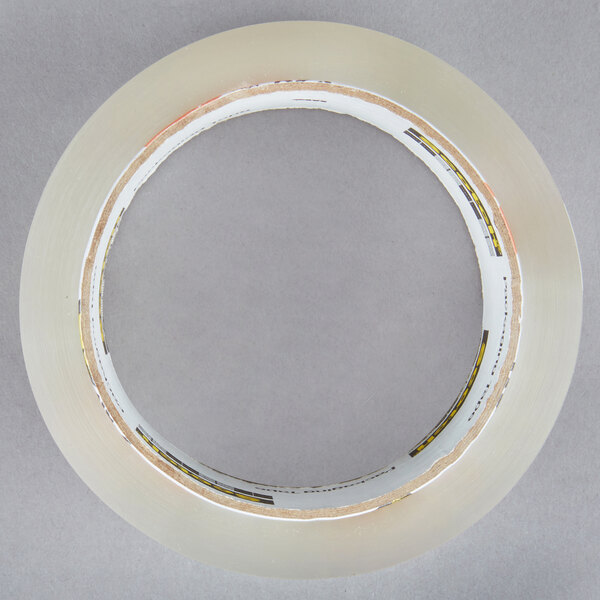 A 3M Scotch clear packaging tape roll.