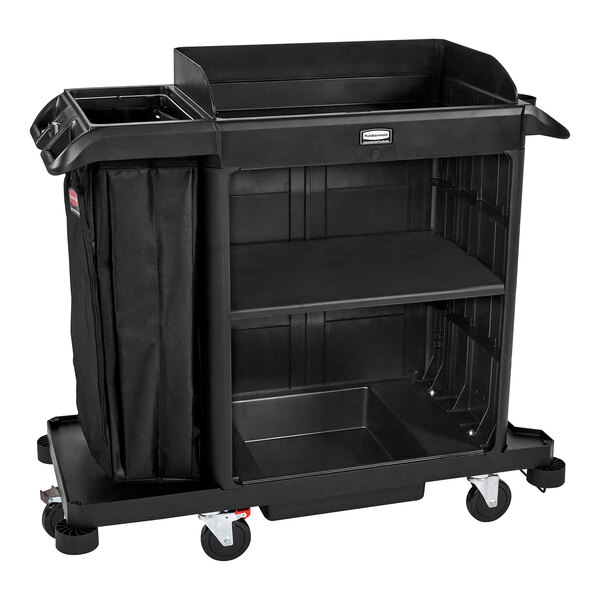 A Rubbermaid compact housekeeping cart with black bags on it.