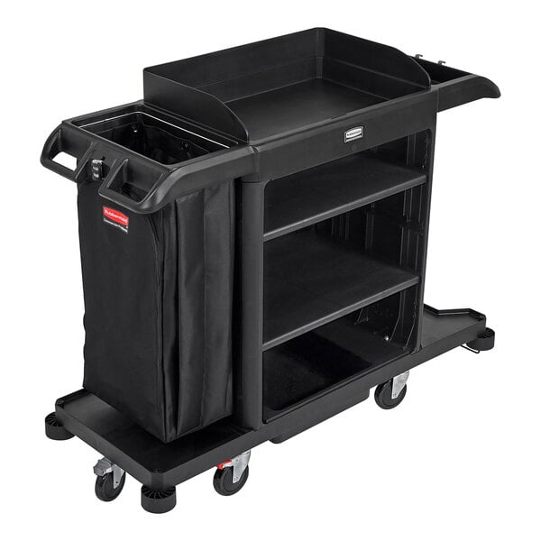A black Rubbermaid® housekeeping cart with a bag on it.