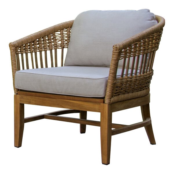 An Outdoor Interiors wicker lounge chair with a cushion.