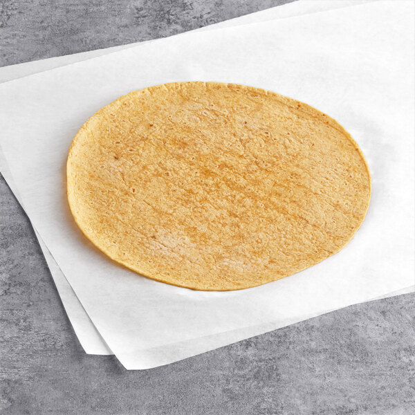 A Celia's jalapeno cheddar flour tortilla on a white surface.