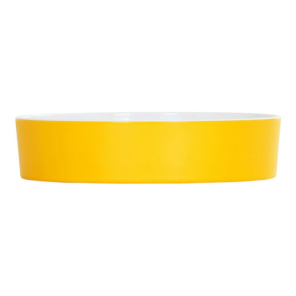 A sunshine yellow round melamine bowl with a white rim.