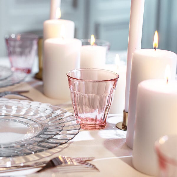 A close up of a Duralex Picardie blush glass on a white table.