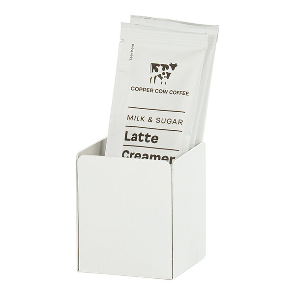 A white metal Cal-Mil modular condiment display with a white cup and lid inside.